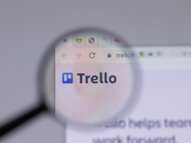 A magnifying glass over the Trello logo on a web browser.